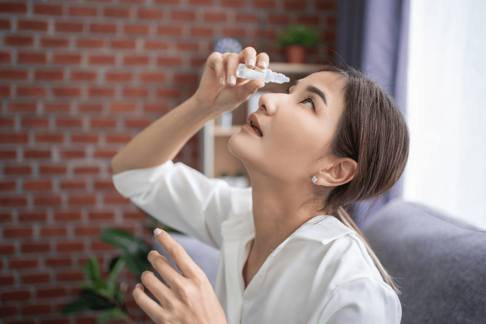 woman using eye drops for dry eye