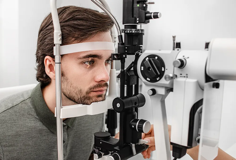 a young man getting his annual eye exam at the eye doctor's