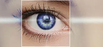 close up of an eye with graphic and symbols representing technology